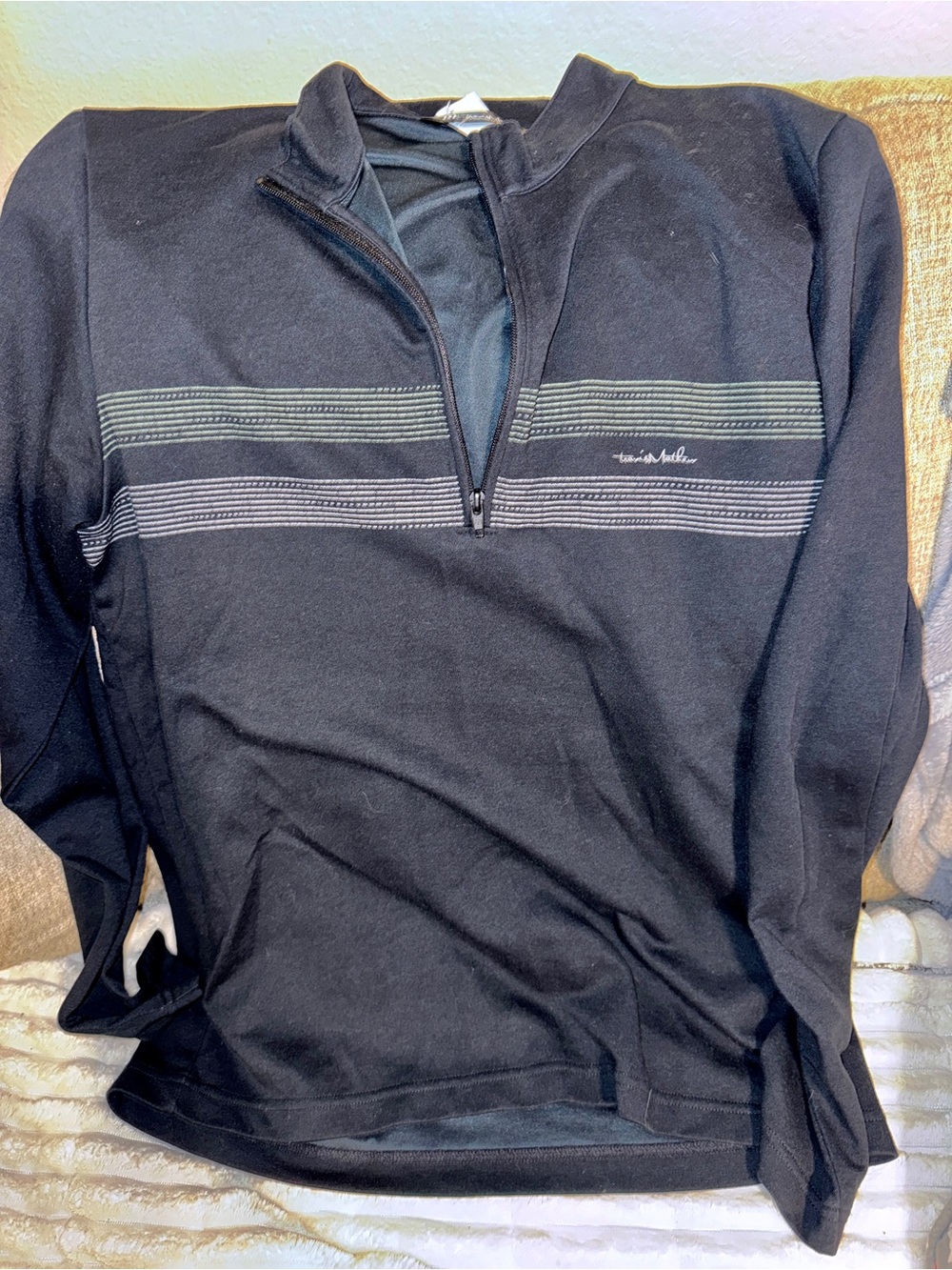 Travis Mathew Men's Blue Quarter-Zip Pull Over with Subtle Stripe Detail.